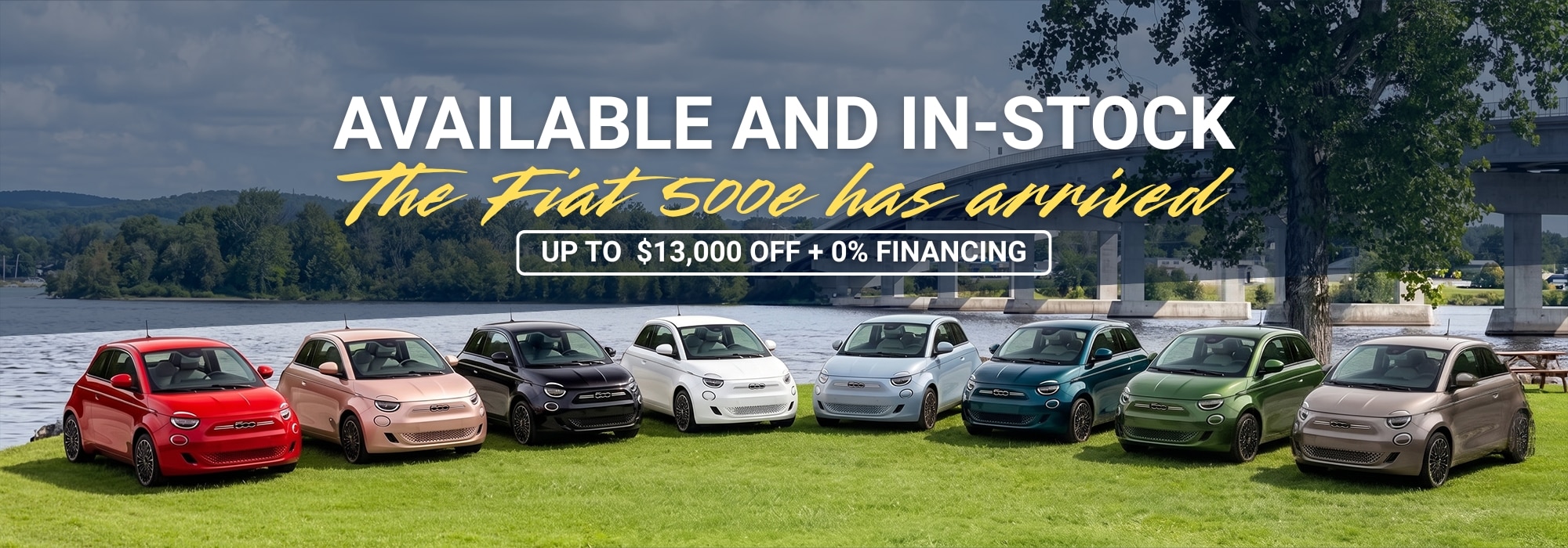 Fiat 500e models lined up by a river, promoting availability and discounts up to $13,000 with 0% financing.